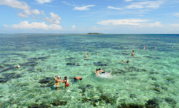 Snorkeling in the crystal clear waters of Angol Point